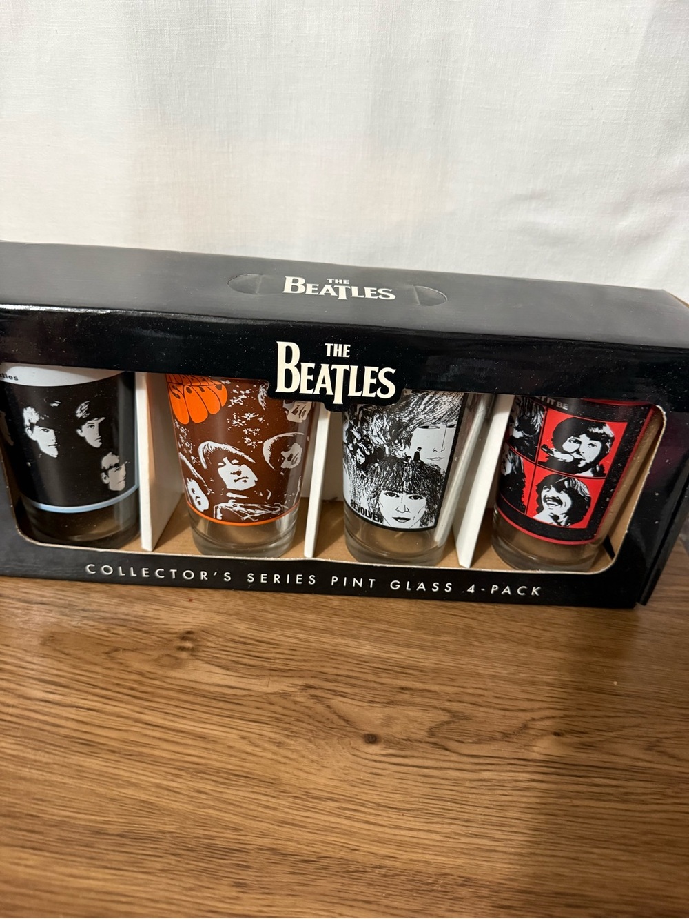The Beatles Pint Glass Set - Black, Orange, White, Red